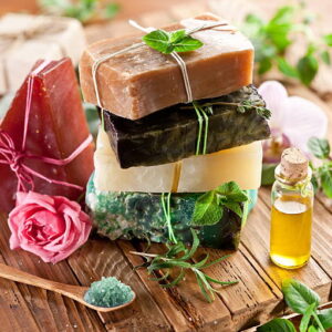 piece of natural soap with herbs and flowers.